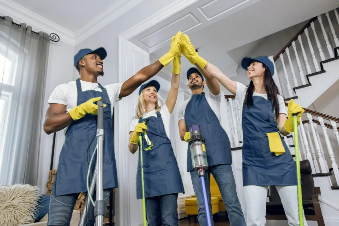 Cleaning team giving a high five after cleaning
